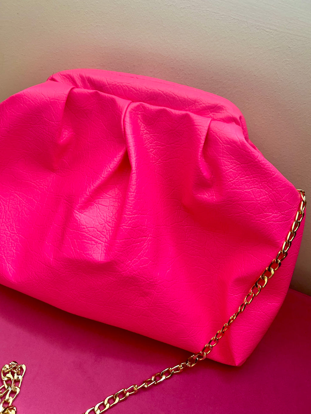 Neon pink dumpling bag